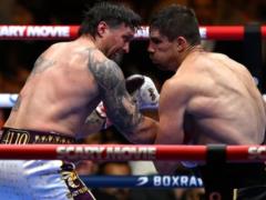 Усик отправил Верховена в нокдаун, защитив звание чемпиона мира по боксу